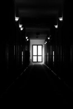 long dark corridor black and white photo of the hotel