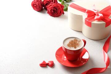 Valentine's day coffee, red gift and red roses on white background. Invitation to dating. Close up. Copy space.