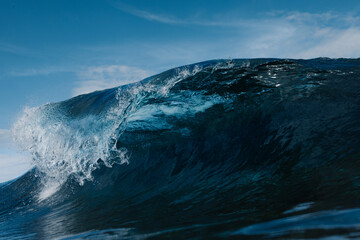Blue wave breaking on a surfing beach in Canary Islands
