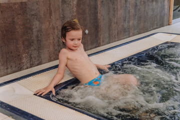 Relaxed boy in a jacuzzi