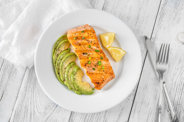 Fried salmon with avocado slices