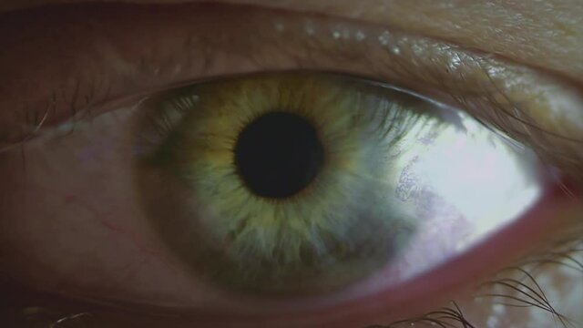 Evil eye with a burning iris. Fantasy or horror cinematic footage. Symbol of anger.