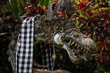 Stone sculpture of an Asian dragon in Bali, Indonesia. Closeup.