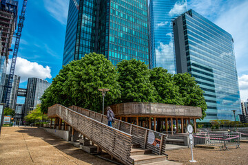 Modern Installation of a path in the trees between skyscrapers in La Defense financial district in...