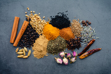 Overhead View of Ras el Hanout Spice Mix Ingredients: Ingredients for a Moroccan spice mix made of...