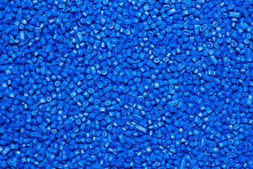 Many bight blue  granules of polypropylene, polyamide. Background. Plastic and polymer industry, industry. Microplastic products.