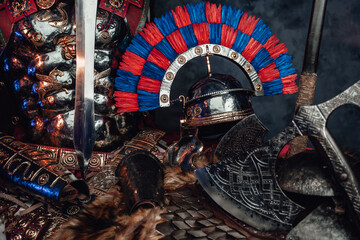 Antique protective armor with combative axe and sword
