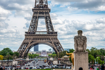 Fototapeta na wymiar View of the Eiffel Tower from Trocadero Garden, a stone Sculpture of the Garden in the foreground, Paris