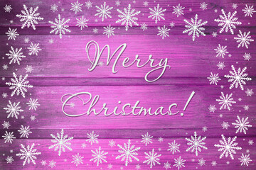 Winter wooden magenta purple mauve nature background with snowflakes around. Texture of painted wood horizontal boards. Merry Christmas card.