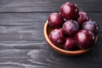 plums fruits natural products on a wooden table top view