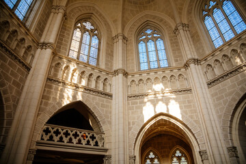 Trebon, South Bohemia, Czech Republic, 9 October 2021: Schwarzenberg family tomb at gothic style in Domanin near castle, Church interior, white stone walls, lancet windows with stained-glass