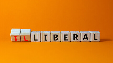 Illiberal or liberal symbol. Turned wooden cubes and changed the word illiberal to liberal. Beautiful orange background. Business, political and illiberal or liberal concept. Copy space. - obrazy, fototapety, plakaty