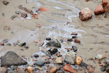 Close up of toxic waste streaming down to ocean at ecological disaster site, copy space