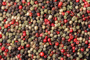 Pile of pepper seeds as background. Top view