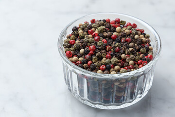 Pile of pepper seeds in a bowl. Horizontal