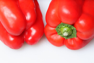 Two sweet red pepper on white background