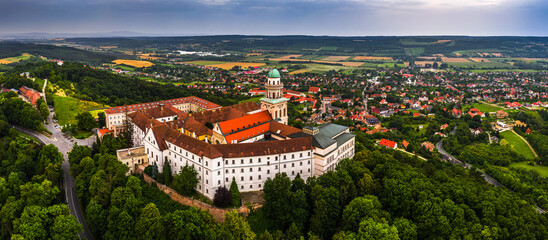 Pannonhalma, Hungary - Aerial panoramic view of the beautiful Millenary Benedictine Abbey of Pannonhalma (Pannonhalmi Apatsag) with clear bluet sky at summertime - obrazy, fototapety, plakaty