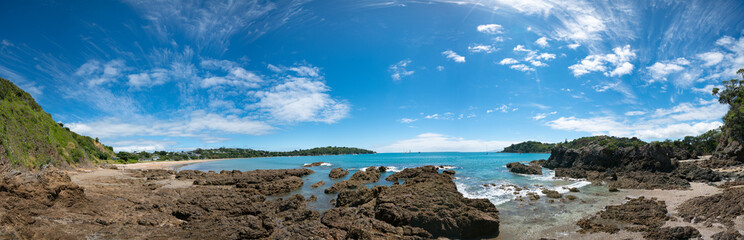 Fototapeta na wymiar Panorama of stone seashore and blue sea New Zealand