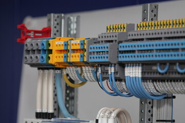1-level and 3-level electric color terminals with connected white and blue mounting wires located...