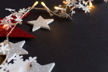 Close up of Christmas decorations on black background with copy space