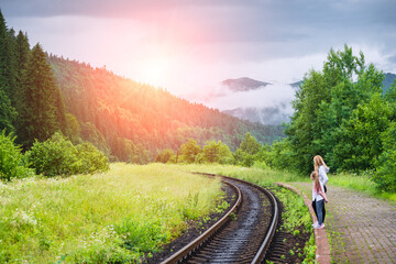 Mother with daughter waiting for the train