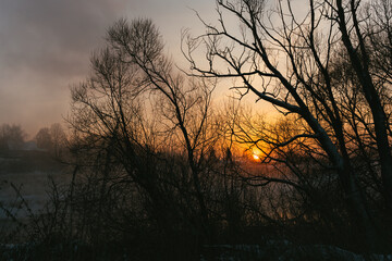 Naklejka premium sunset over the river
