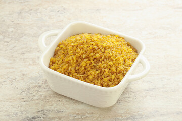 Raw bulgur in the bowl