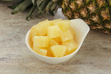 Marinated pineapple slices in the bowl