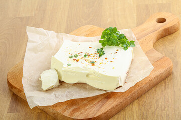 Greek Feta cheese over board