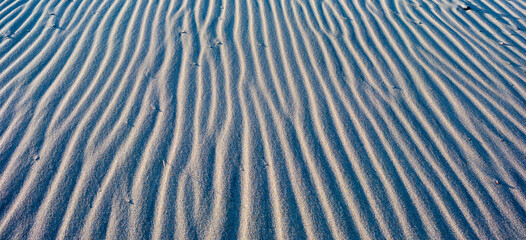 Close up of a sand dune at sunset