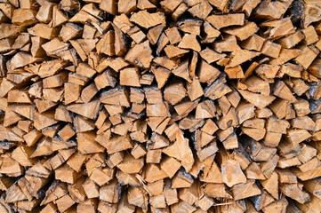 A big pile of stacked logs.