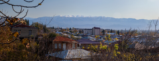 Fototapeta na wymiar Kutaisi city overview panorama with the Caucasus mountains in the background.