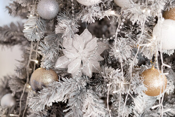 beautiful white Christmas decorations on a white tree, new year 2022, holiday