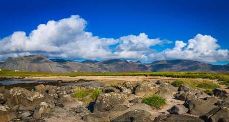 scenic landscape with rocky mountains and valley , iceland