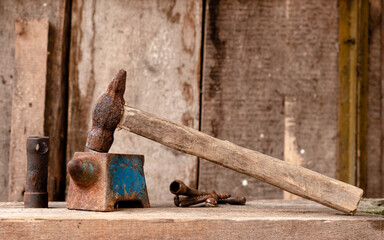 An old hammer and anvil in the workshop