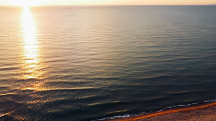 Bird's eye view of sandy shore at sunset in Tuscany region, Italy. Beautiful landscape with...