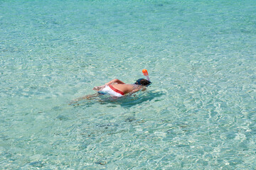 Boy snorkelling on the beach, Funny day
