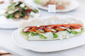 Delicious breakfast sandwich with mozzarella and vegetables
