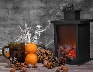 oranges, nuts, cones and flame lantern composition