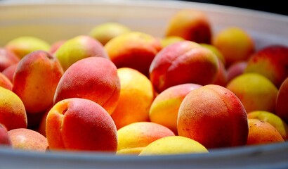Juicy and ripe fruits. Bowl of peaches