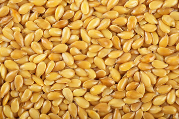 Background texture of golden flax seeds. Linseeds, Omega-3.
