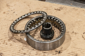 Disassembled angular contact bearing for repair in a workshop.