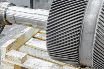 Toothed drum of large diameter with longitudinal and transverse teeth cut on a gear cutting machine.