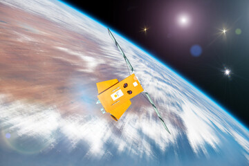 Orbiting satellite rushes through space orbiting the Earth. Elements of this image furnished by NASA.