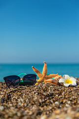 Accessories on the beach by the sea. Selective focus.