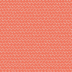 Seamless repeating pattern with hand drawn wavy lines on pink background for surface design and other design projects