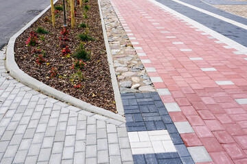 new colorful paved walkway with cobblestones of different colors