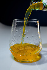 Blue light with mango juice and transparent glass