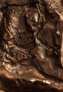 A metal piece of bronze, frozen in a bizarre shape, high resolution