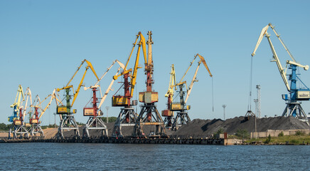 Fototapeta premium Industrial loading cranes at a shipyard